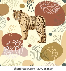 Seamless tropical pattern with tiger, leaves. African background. Design for wallpaper, textile design, packing, textile, fabric. Tropics, paradise, resort theme. Wild cat, feline