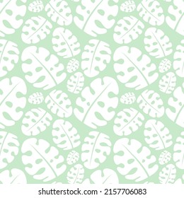 Seamless tropical pattern with white monstera leaves on the green background. Vector summer illustration of a flamingo for kids, textiles, nursery, birthday, shower, paper, clothes, fabric, gift