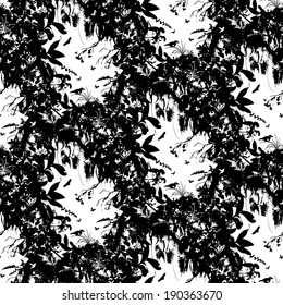 Seamless tropical vector pattern inspired by plants and nature of jungle and rainforests, mostly ferns and palm trees with small birds, hummingbirds, butterflies in black and white colors