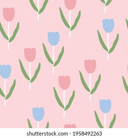 Seamless tulip pattern with blue and pink tulips and leaves on a light orange background.Flower background.Flower wallpaper.
