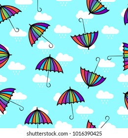 Seamless umbrella and clouds with rain drops pattern background. Vector Illustration
