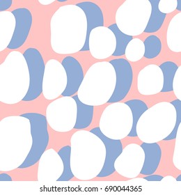 Seamless vector abstract hand drawn pattern. Round shapes in white with blue shadows behind them on pink background.