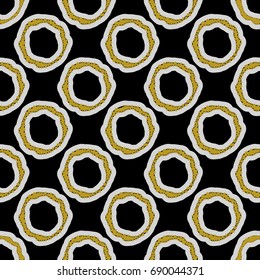 Seamless vector abstract pattern. Rings in grey and ochre yellow on black background.