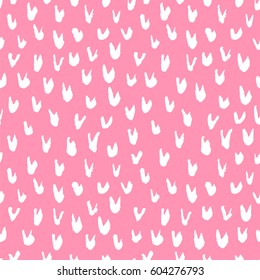 Seamless vector abstract pattern of white spots on a pink background. Packing paper.