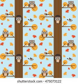 Seamless vector autumn pattern with trees and owls sitting on branches