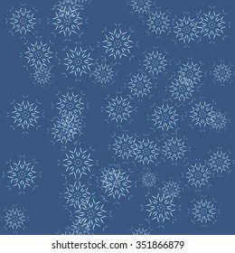 Seamless vector background. Abstract Christmas pattern with snowflakes on blue.