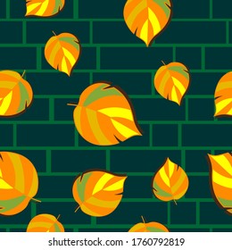 Seamless vector background with autumn leaves on brick wall background.
