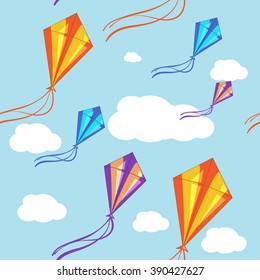 Seamless vector background with colorful kites in the blue sky.