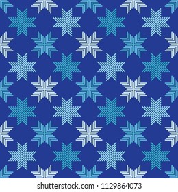 Seamless vector background with decorative snowflakes. Winter pattern. Textile rapport.