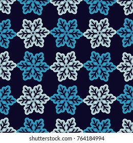 Seamless vector background with doodle snowflakes. Winter pattern. Textile rapport.