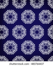Seamless vector background with ethnic pattern. Damask round floral ornament.