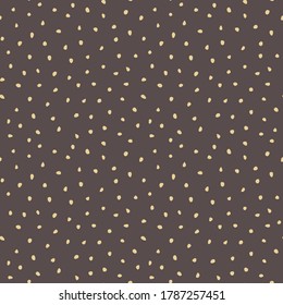 Seamless vector background with golden random elements. Abstract ornament. Dotted abstract pattern
