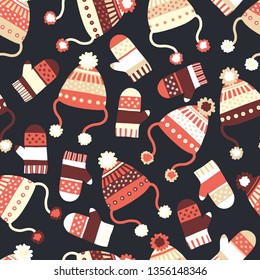 Seamless vector background with hats and mittens. Contemporary seasonal winter pattern tile with knitted winter clothes in red black beige. Cozy handmade knit Winter wear design, Scandinavian style