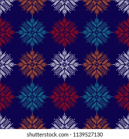 Seamless vector background with Norwegian snowflakes. Pixel snowflakes. Winter pattern. Textile rapport.