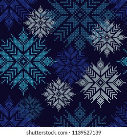Seamless vector background with Norwegian snowflakes. Pixel snowflakes. Winter pattern. Textile rapport.