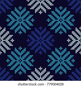 Seamless vector background with Norwegian snowflakes. Pixel snowflakes. Winter pattern. Textile rapport.