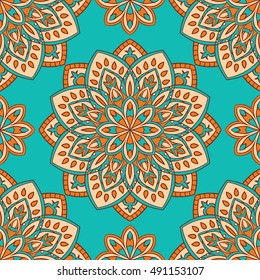 Seamless vector background. The pattern with colorful mandalas. Oriental orange and turquoise ornament. Template for textiles.