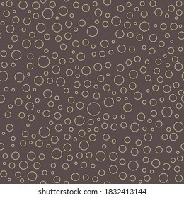 Seamless vector background with random golden bubbles. Abstract ornament. Dotted abstract pattern