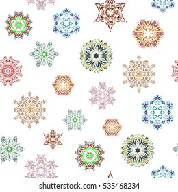 Seamless vector background. Winter Holiday Knitted Pattern with pink, neutral and blue Circles, Dots and Snowflakes On a White Background.