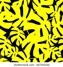 Seamless vector background with Yellow leaves of palm trees on a black background. Summer tropical design. Textile rapport.
