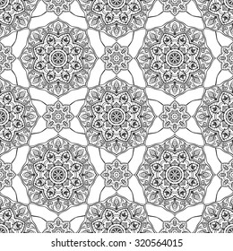 Seamless vector black and white background. Oriental graphic ornament of mandalas. Medieval pattern of round elements. Template for the carpet. Elegant ornament for embroidery.