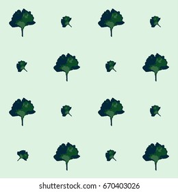 Seamless vector boho hipster pattern with Gingko Biloba leaves on a mint green background. Floral summer pattern for notebooks or children's fashion. Retro vintage trendy exotic endless background.