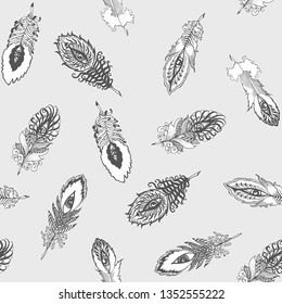 seamless vector chaotic pattern of feathers on a gray background 