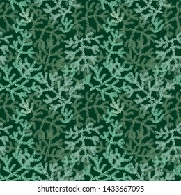 A seamless vector christmas holiday pattern with green tree branches. Surface print design.
