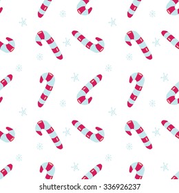 Seamless vector Christmas texture. Seamless backdrop with pink candy canes and snowflakes.  Simple style pattern background with traditional Christmas holiday symbols. Wrapping paper texture.