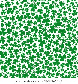 Seamless vector clover background for St. Patricks Day pattern. Green clover leaves of different sizes and shapes are collected in a seamless pattern. Seamless pattern with the symbol of Ireland 