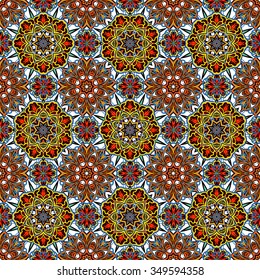 Seamless vector colorful pattern. East ornament with colorful details on the turquoise background. Tracery of mandalas for textile