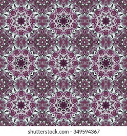 Seamless vector colorful pattern. East ornament with colorful details on the turquoise background. Tracery of lilac mandalas for textile