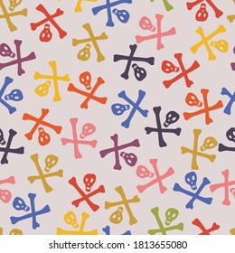 Seamless vector colorful pattern of skulls and bones on white background. The design is perfect for decorations, textiles, surfaces, wallpaper, wrapping paper