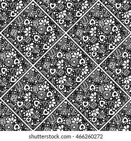 Seamless vector decorative hand drawn pattern. Black and white ethnic endless background with ornamental decorative elements with traditional motives, geometric figures, dots and flowers. 