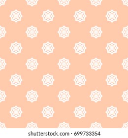 Seamless vector decorative pattern for textile, paper, wallpaper and other materials. Abstract ornament from small round elements on a background of peach color