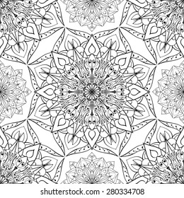 Seamless vector ethnic ornament. Openwork pattern of mandalas on a white background.