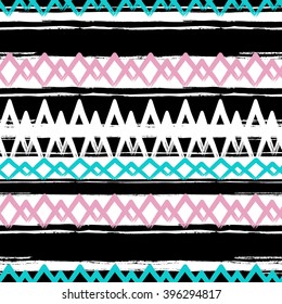 Seamless vector ethnic pattern. Brush stroke elements. Boho stripes texture. Crossing brush strokes