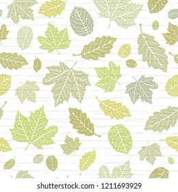 Seamless Vector Fallen Green & Yellow Spring Leaves On Shiplap Wood Plank Background. Great For Seasonal Invitations, Wedding, School, Stationery, Greeting Cards, Fabric, Paper Crafting, & Home Decor.