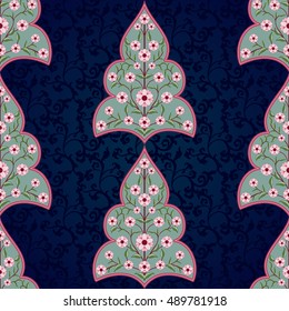 Seamless vector floral background. Fantasy flowers with leaves and curls. The motives of the paintings of ancient Indian fabrics. Dark backdrop. Tree of Life collection.