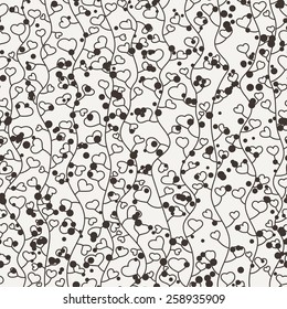 Seamless vector floral pattern of curved vines with light hearts and chaotic points 