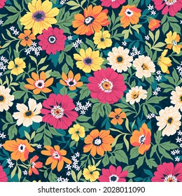 Seamless vector floral pattern. Liberty background of bright colorful realistic flowers. Print with bouquets of flowers from the garden. Bright yellow and pink chrysanthemums on a blue background.