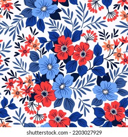 Seamless vector floral pattern. Liberty background of bright red and blue realistic flowers. Print with bouquets of flowers from the garden. Gentle flowers on a white background.