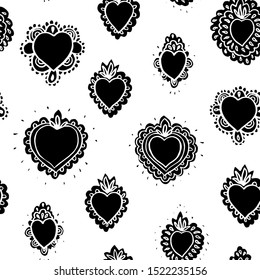 Seamless vector folk art grunge burning heart pattern with hand drawn tin work heart in black. Tatoo style bold design for valentine, wedding, mothers day and your personal sweetheart.