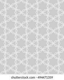Seamless vector geometric background in arabian style. Islamic pattern, ethnic ornament. Endless hexagonal texture for wallpaper, banners, invitation cards. Gray and white graphic lace background