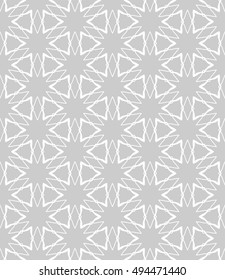 Seamless vector geometric background in arabian style. Islamic pattern, ethnic ornament. Endless hexagonal texture for wallpaper, banners, invitation cards. Gray and white graphic lace background