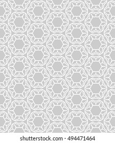 Seamless vector geometric background in arabian style. Islamic pattern, ethnic ornament. Endless hexagonal texture for wallpaper, banners, invitation cards. Gray and white graphic lace background