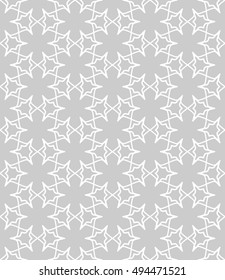 Seamless vector geometric background in arabian style. Islamic pattern, ethnic ornament. Endless hexagonal texture for wallpaper, banners, invitation cards. Gray and white graphic lace background