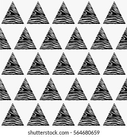 Seamless vector geometric pattern. Graphic black and white triangles placed in a random order. Monochrome.