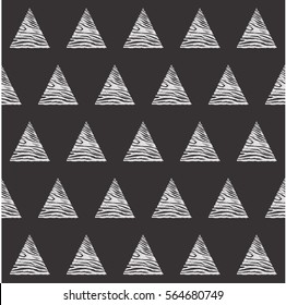 Seamless vector geometric pattern. Graphic black and white triangles placed in a random order. Monochrome.