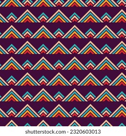 Seamless vector geometric pattern. Geometric striped triangular shapes ornament. Triangles ethnic pattern. Stylish texture. Vector color ethnic background.